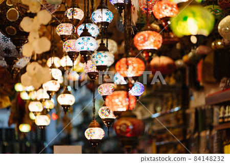 Mosaic Turkish lanterns in the evening in a souvenir shop. 84148232