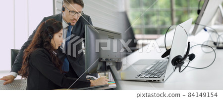 Business people wearing headset working in office broaden view 84149154