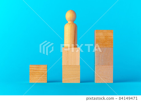 Toy wooden blocks on blue background front view Toy wooden blocks on blue background front view 84149471