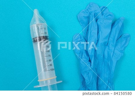 Anti Vaccination Concept - Syringe in a Condom 84150580