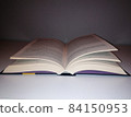 Open book on the table 84150953