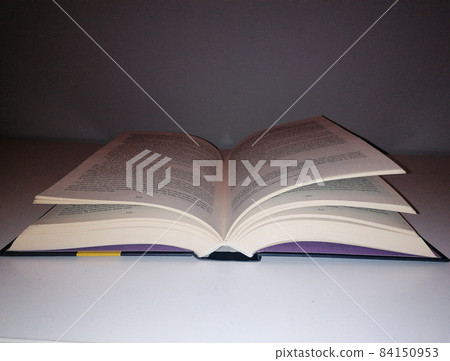 Open book on the table Open book on the table 84150953