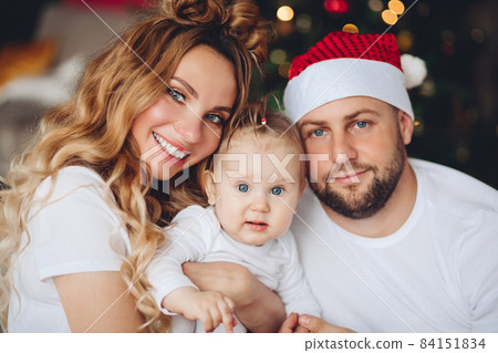 Cute baby with parents at Christmas. Christmas Cute baby with parents at Christmas. Christmas 84151834