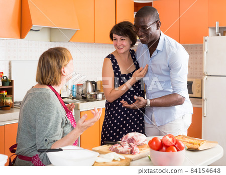 Aged woman meeting future husband of daughter 84154648
