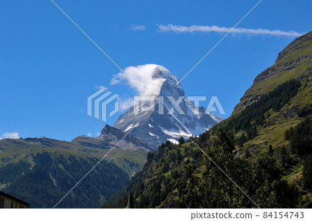 Impressive Matterhorn against the backdrop of the blue sky seen from Zermatt Impressive Matterhorn against the backdrop of the blue sky seen from Zermatt 84154743