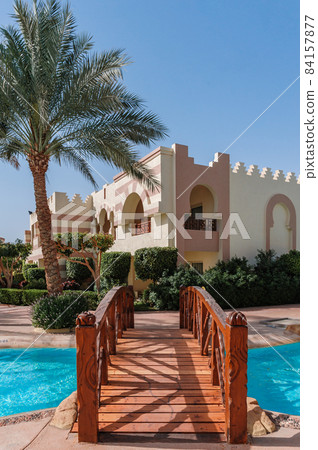 Happy in luxury villa garden for relaxing in spa resort hotel. In front of the house is a beach view. You can sleep on the bed and see sunrise or sunset from the sea. Behind is a small garden. Happy in luxury villa garden for relaxing in spa resort hotel. In front of the house is a beach view. You can sleep on the bed and see sunrise or sunset from the sea. Behind is a small garden. 84157877