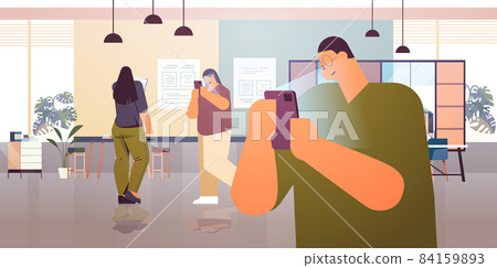 addicted businesspeople using digital gadgets business people active in social networks digital addiction concept 84159893