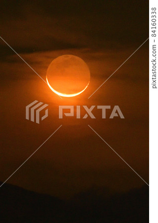 The red crescent moon of the earthlight rising in the Kanto Mountains, Hakushu-cho, Hokuto City 84160338