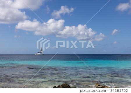 The boat sails on the azure sea. Seascape with a boat. 84161792