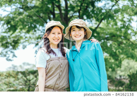 Women trekking and climbing 84162138