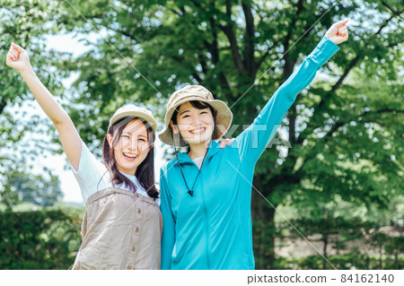 Women trekking and climbing 84162140