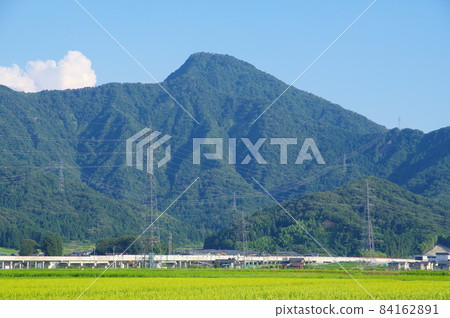 Hokuriku Shinkansen at the foot of Mt. Hino, Echizen City, Fukui Prefecture Hokuriku Shinkansen at the foot of Mt. Hino, Echizen City, Fukui Prefecture 84162891