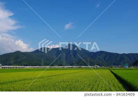 Hokuriku Shinkansen at the foot of Mt. Hino, Echizen City, Fukui Prefecture Hokuriku Shinkansen at the foot of Mt. Hino, Echizen City, Fukui Prefecture 84163409