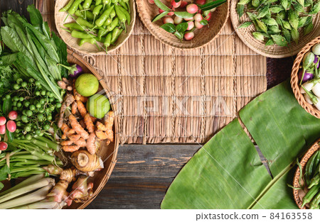 Fresh green organic Southeast Asian vegetables and spices from local farmer market,Northern Thailand 84163558