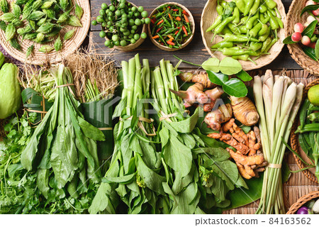 Fresh green organic Southeast Asian vegetables and spices from local farmer market,Northern Thailand 84163562