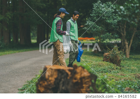 Volunteer picking up trash Volunteer picking up trash 84165582