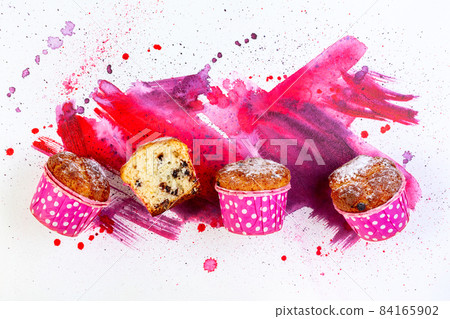 Muffins with pieces of chocolate. 84165902
