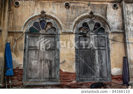 Wood vintage window on the old wall, Western Architecture style, Selective focus. 84166110