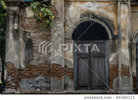 Wood vintage window on the old wall, Western Architecture style, Selective focus. 84166121