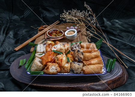 Fried taro rolls and Deep fried spring rolls, Fried tofu, Fried radish, Fried taro and black beans. Fried taro rolls and Deep fried spring rolls, Fried tofu, Fried radish, Fried taro and black beans. 84166903