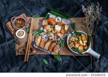 Fried taro rolls and Deep fried spring rolls, Fried tofu, Fried radish, Fried taro and black beans. 84166910