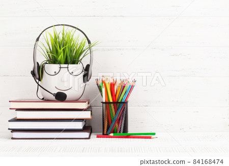 Home office with supplies and plant 84168474
