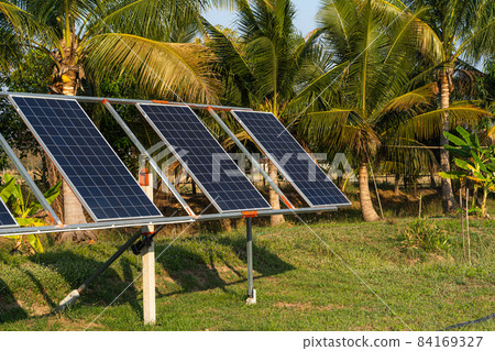 power solar panel for agriculture in a rural houses area Agricultural fields blue sky background,Agro-industry of household Rural style in Thailand, smart farm alternative clean green energy concept power solar panel for agriculture in a rural houses area Agricultural fields blue sky background,Agro-industry of household Rural style in Thailand, smart farm alternative clean green energy concept 84169327