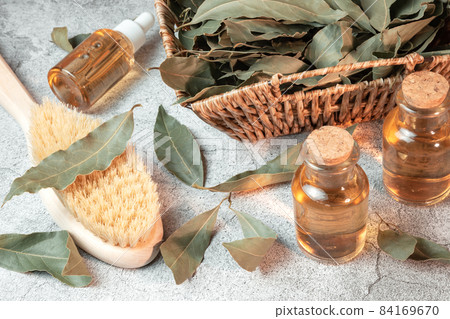 Cosmetology and personal care. Infusion decoction of bay leaf essential oil in a bottle, natural antiseptic, antioxidant, acne remedy, macronutrients for skin and hair. Herbal medicine Cosmetology and personal care. Infusion decoction of bay leaf essential oil in a bottle, natural antiseptic, antioxidant, acne remedy, macronutrients for skin and hair. Herbal medicine 84169670
