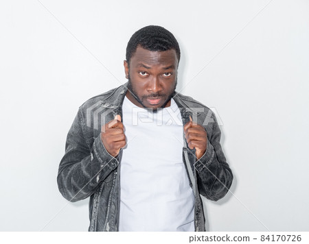 Macho man. Fashion look. Masculine power. Cool hipster guy in stylish jeans jacket posing isolated white. Macho man. Fashion look. Masculine power. Cool hipster guy in stylish jeans jacket posing isolated white. 84170726