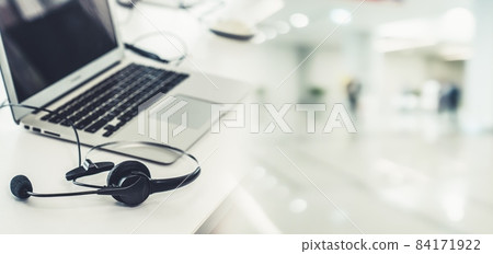 Headset and customer support equipment at call center ready for actively service Headset and customer support equipment at call center ready for actively service 84171922