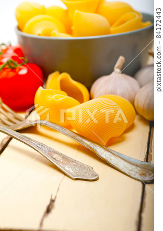 Italian snail lumaconi pasta with tomatoes 84172443