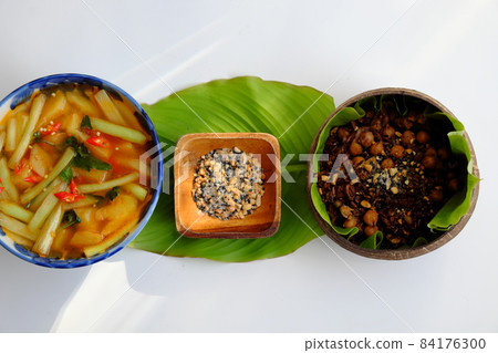 Vietnamese cuisine from red rice  with sesame salt nutrition rice dish  on green leaf 84176300