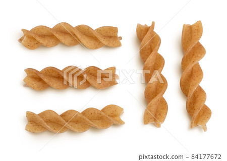 Wolegrain fusilli pasta from durum wheat isolated on white background with clipping path and full depth of field. Top view. Flat lay. Wolegrain fusilli pasta from durum wheat isolated on white background with clipping path and full depth of field. Top view. Flat lay. 84177672