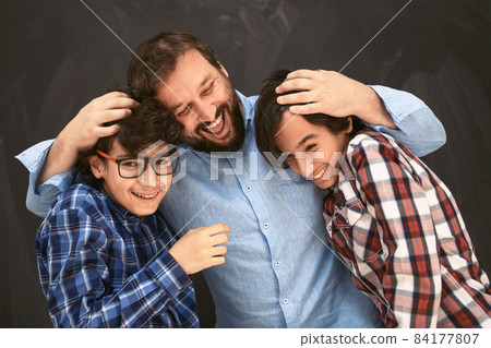 happy father hugging sons unforgetable moments of family joy in mixed race middle eastern arab family 84177807