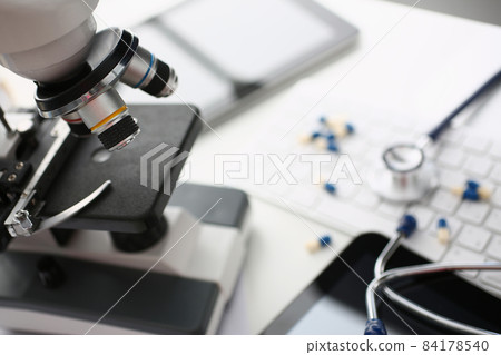 Modern microscope in biological laboratory for science investigations 84178540