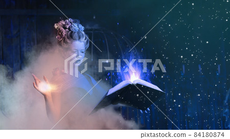 Christmas fairy tale concept. Snow queen calling winter use book of spells Christmas fairy tale concept. Snow queen calling winter use book of spells 84180874