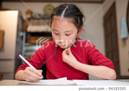 Girl studying at home Girl studying at home 84183505