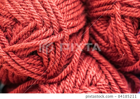 Texture of pink fluffy woolen threads for knitting closeup. 84185211