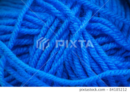 Texture of blue soft woolen threads for knitting closeup. Texture of blue soft woolen threads for knitting closeup. 84185212
