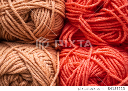 Texture of pink fluffy woolen threads for knitting closeup. Texture of pink fluffy woolen threads for knitting closeup. 84185213