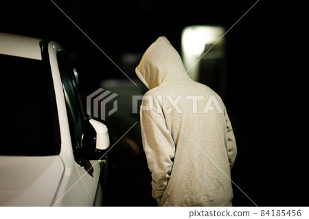 A man wearing a hood A man wearing a hood 84185456