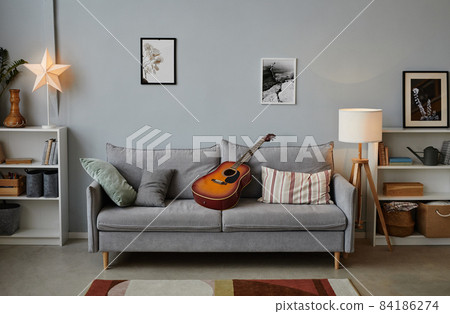 Cozy Living Room with Guitar 84186274