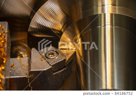 Close-up scene of lathe machine finishing cut the brass shaft parts by lathe tools. Close-up scene of lathe machine finishing cut the brass shaft parts by lathe tools. 84186752