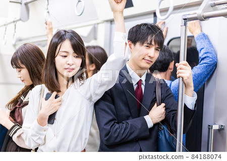 Inside a crowded train Inside a crowded train 84188074