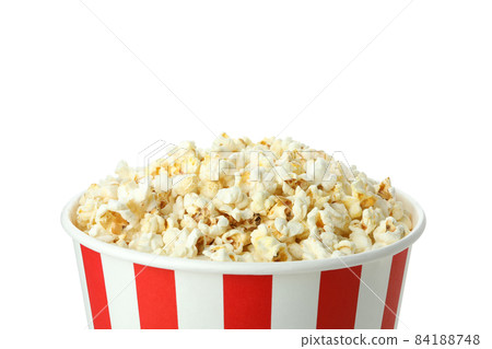 Striped paper cup with popcorn isolated on white background 84188748