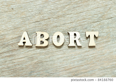 Alphabet letter in word abort on wood background 84188760