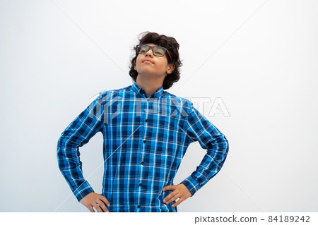 portrait of smart looking arab teenager with glasses wearing a hat in casual school look isolated on white copy space portrait of smart looking arab teenager with glasses wearing a hat in casual school look isolated on white copy space 84189242