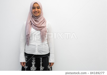 Arab female Muslim in traditional hijab clothes for praying namaz. Selective Focus  84189277
