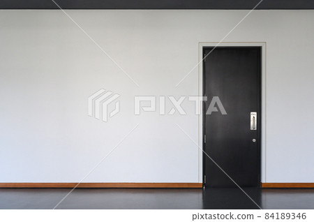 modern black Wooden door Closed Shut with metallic handle on white wall. Empty room interior. Free space for display or montage products. modern black Wooden door Closed Shut with metallic handle on white wall. Empty room interior. Free space for display or montage products. 84189346