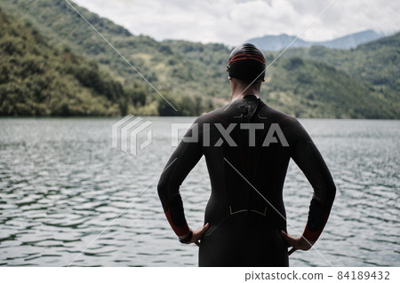 triathlete swimmer portrait wearing wetsuit on training 84189432